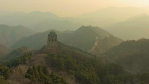 Great Wall of China at Sunset and Mountains. Badaling. Aerial View. Drone Flies Forward