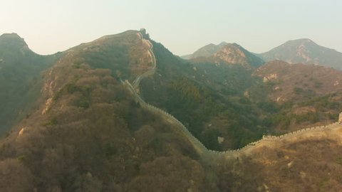 Great Wall of China at Sunset and Mountains. Badaling. Aerial View. Drone Flies Forward, Tilt Up