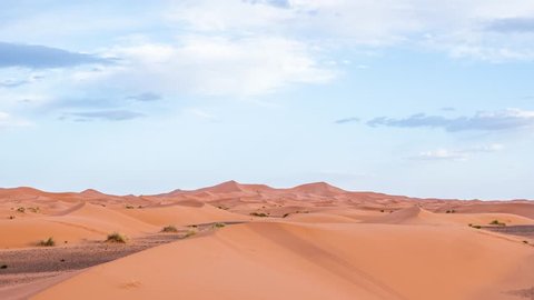 Day to night Timelapse of the dunes and the sky in the desert
