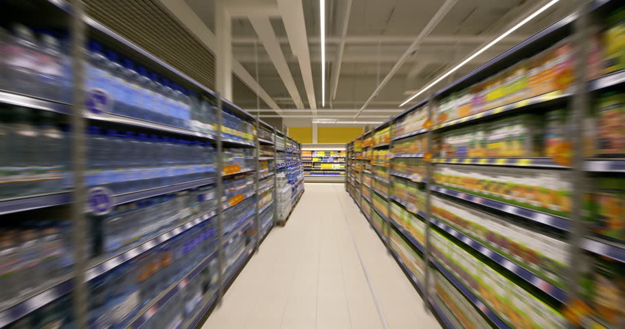 4K - Camera moves in the supermarket. Food shelves Royalty-Free Stock Footage #1028019317