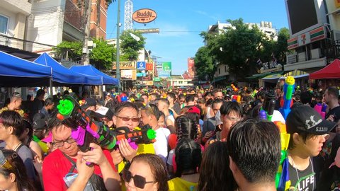 Bangkok, Thailand-April 13, 2019: Locals and tourists celebrate Songkran Festival, Traditional Thai New Year. People play water, and use water guns to enjoy the festival.