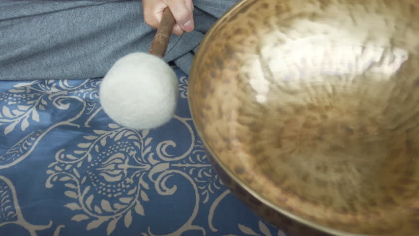 Slow motion and close up of Singing Bowl. Relax concept