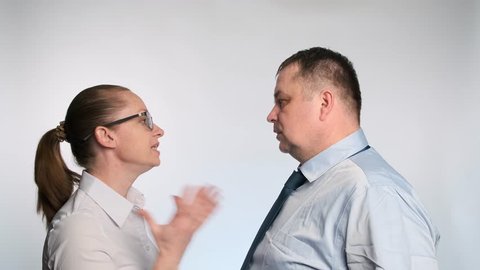 business woman reprimands office employee. The conflict between the boss and subordinate.