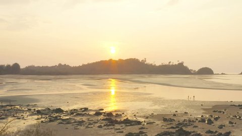 sun light through the hole of Hinthalu at Buffalo beach Phayam island Ranong Thailand.
Hinthalu is a new landmark sunset viewpoint of Phayam island in Ranong province