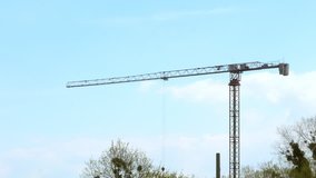 Working tower cranes, buildings