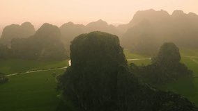 4k Aerial drone footage - Beautiful mountains, jungle, and rice fields of northern Vietnam at sunset.  Asia