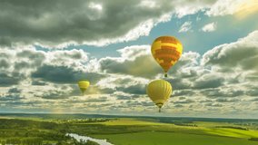 Time lapse clouds in a beautiful summer landscape with a balloon, video loop