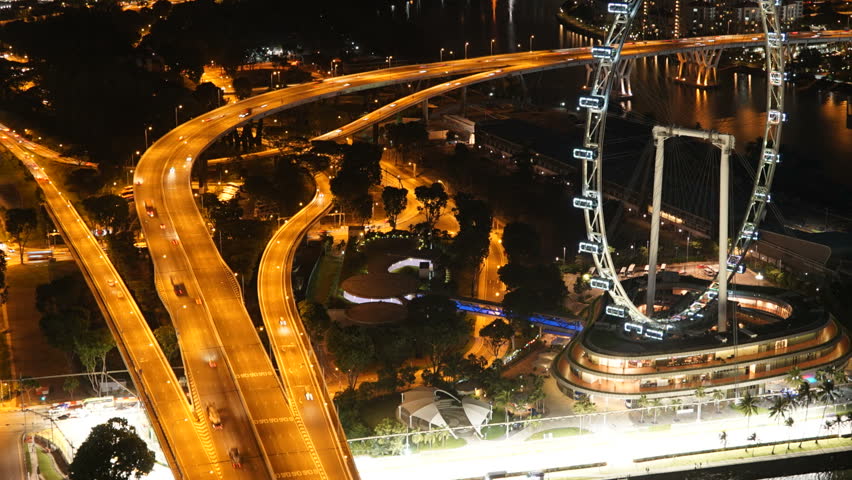 Singapore City Night Traffic Towers and Flyer Ferris Wheel Colourful Timelapse