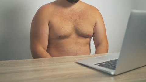 Fat man will crack his fat boobs sitting at the computer 