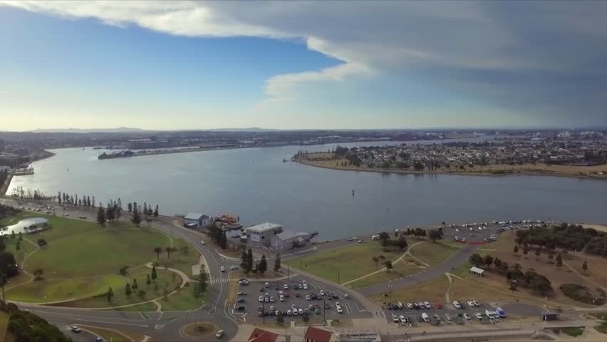 Aerial drone high shot of the city of Newcastle, revealing beach, harbour, Fort Scratchley and docks