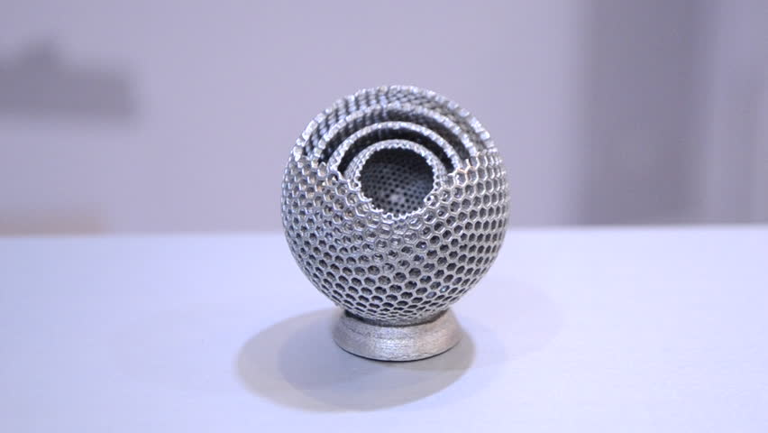 Object printed on metal 3d printer close-up. Object printed in laser sintering machine. Modern 3D printer printing from metal powder. Concept progressive additive DMLS, SLM, SLS 3d printing technology