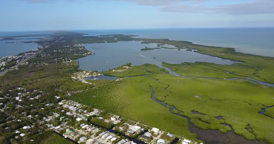 AERIAL: slow and wide push over the island of Key Largo, Florida.