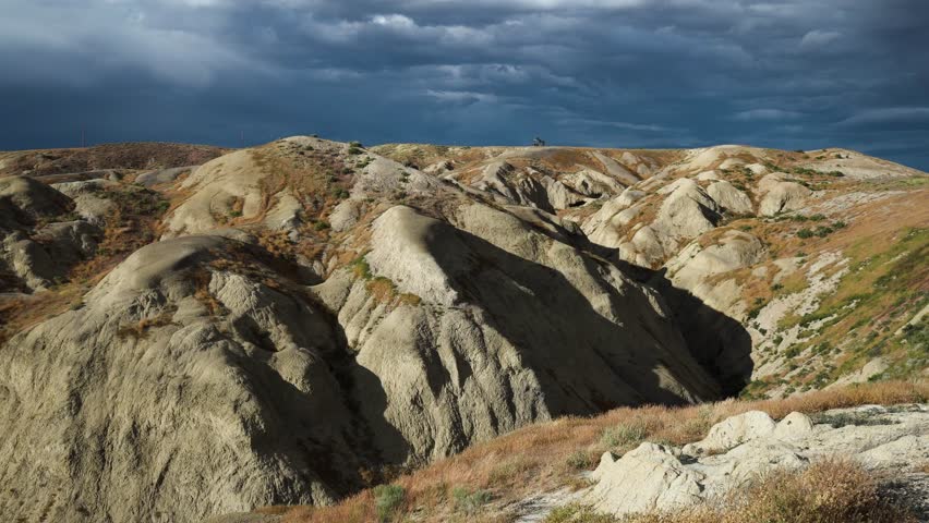 View over the dramatic Wyoming landscape with dark storm clouds overhead
