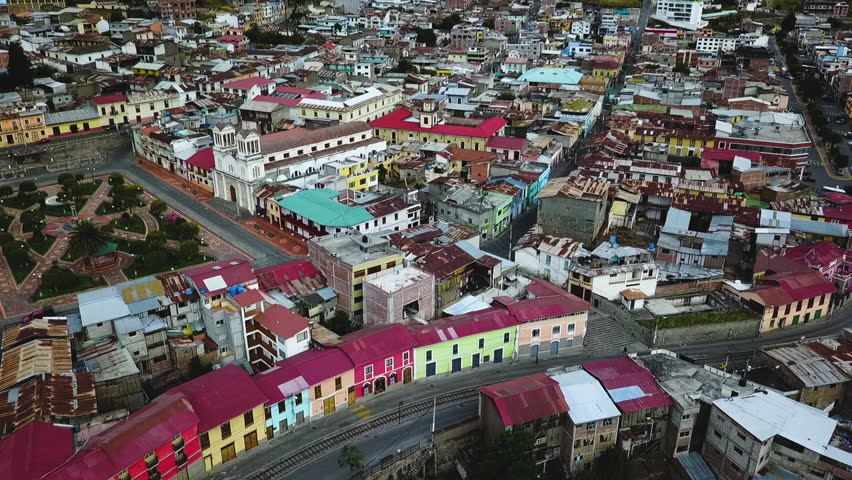 Aerial over the colorful rooftops of downtown Alausí, Ecuador