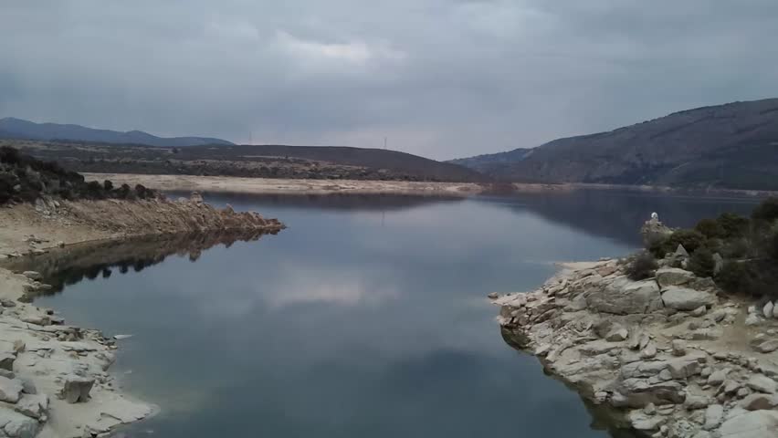 Beautiful aerial footage of a lake and mountains in Spain