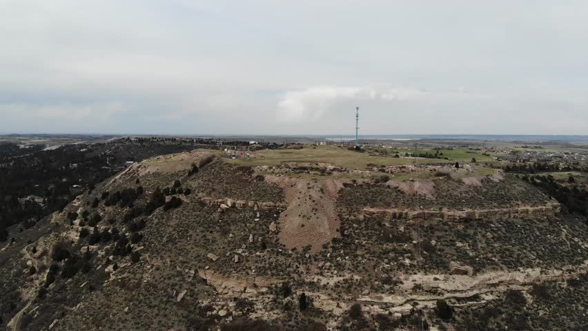 A reverse pan of tall butte