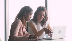 Female caucasian professional marketing manager executive teaching young african american intern worker explaining new work to black trainee learning new skills listening to mentor looking at laptop - Powered by Shutterstock - Get 15% off with code: PIKWIZARD15