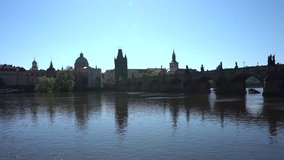 4K VIDEO  In the background Panorama of Charles Bridge, Prague, Czech Republic. Sunny day. 