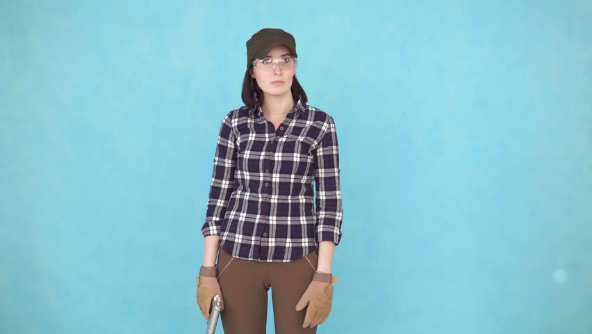 portrait of a girl with a gun shooter glasses