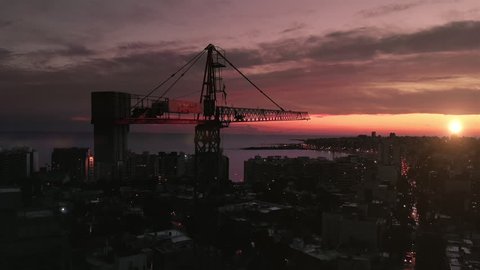 Construction Crane in the City at Sunset
