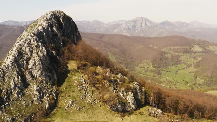 Beautiful mountain landscape with fresh spring vegetation, Romania - aerial view