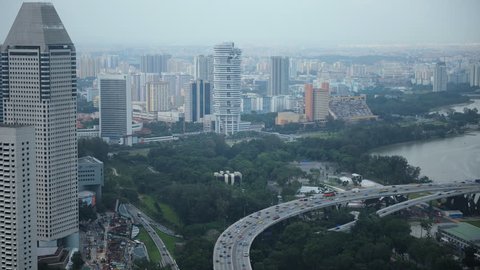Time Lapse Aerial View of Singapore City Skyline Car Traffic on Busy Highway Day