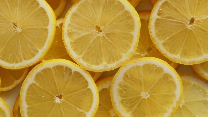 Lemon slices closeup, food summer background, fruits top view. Rotate Royalty-Free Stock Footage #1028123027