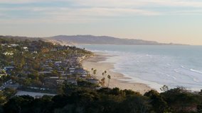 Aerial drone video of the beautiful Del Mar coastline at sunset.