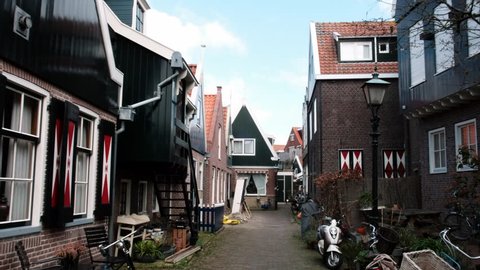 Typical small Dutch houses facades in Volendam. Beautiful architecture Volendam Netherlands 03.18.2019