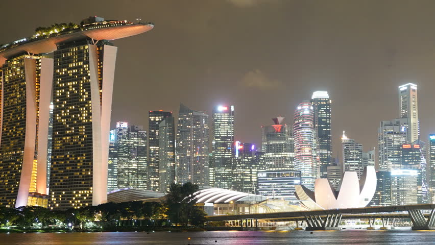 Singapore skyline at night, time lapse zoom out shot