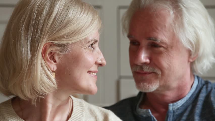 Close up portrait attractive faces elderly couple in love retired family smiles looks at camera, fifty year old spouses lifelong relationships devotion anniversary, medicare medicine insurance concept Royalty-Free Stock Footage #1028137085