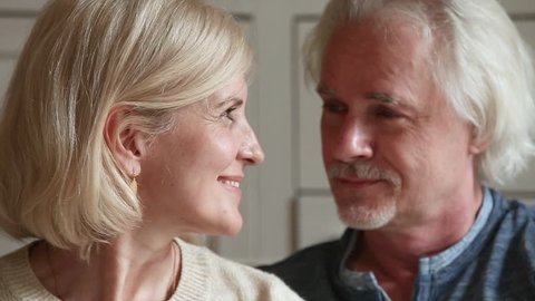 Close up portrait attractive faces elderly couple in love retired family smiles looks at camera, fifty year old spouses lifelong relationships devotion anniversary, medicare medicine insurance concept
