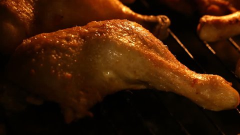 Close-up of baking hot grill chicken legs in the oven with grain processed