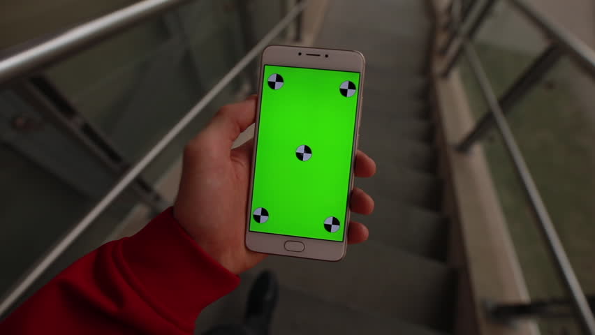 1st person view, blank green screen of smartphone holding male hand | Shutterstock HD Video #1028155469