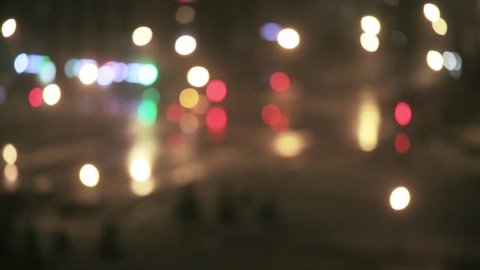 Car traffic flashing in the city and sleet at night