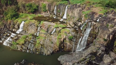 Helicopter overall great Pongour waterall full-flowing multi-tiered rock cascades tropical natural landscape. Exotic stones covered moss. Dalat Vietnam landmark. Travel tourism best sight