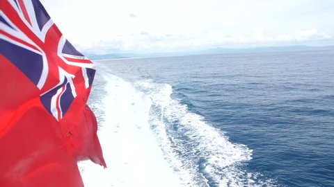 Civil Ensign Fijian Flag Flying In Wind On The Back Of A Boat