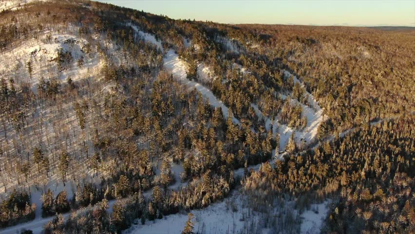 Ski Snowboard Resort Mount Bohemia in Northern Michigan Copper Harbor Sunrise in the Forest.
