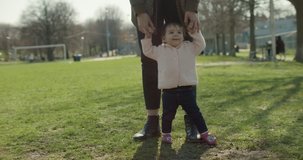 Beautiful Mother and her baby daughter exploring the outdoors. 4K real life, candid footage.