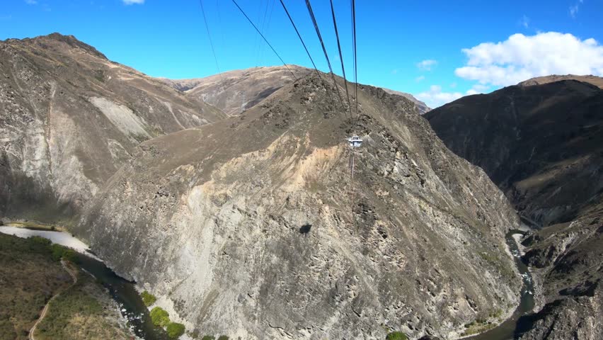 Riding the Cart out to the jumping platform to Bungy Jump at the Nevis Bungee jumping site in Queenstown New Zealand.
