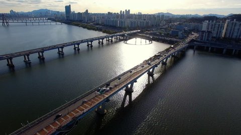 Korea, Seoul Han river front, car passing over bridge