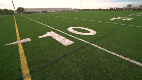 A panning shot of a high school American Football stadium.