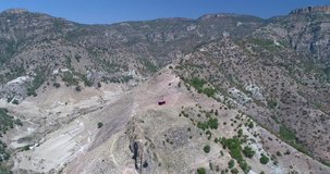 Aerial pull back shot of a cable car in the Urique Canyon in Divisadero, Copper Canyon Region, Chihuahua.