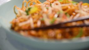 American chop suey/ chopsuey video / footage. It's an indochinese food. served in a bowl with chop sticks. selective focus