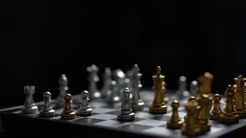 Close up man moving silver king chess defeat enemy on chessboard winner and victory concept,strategy planning business Slow motion