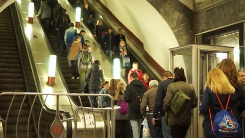 moscow / russia april 14 2019: a lot People riding the escalator in metro station. walking to stairs and run subway