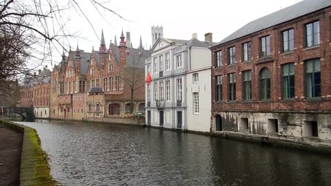 Bruges, Belgium - January 31, 2017: buildings and river in Bruges in a cloudy day.