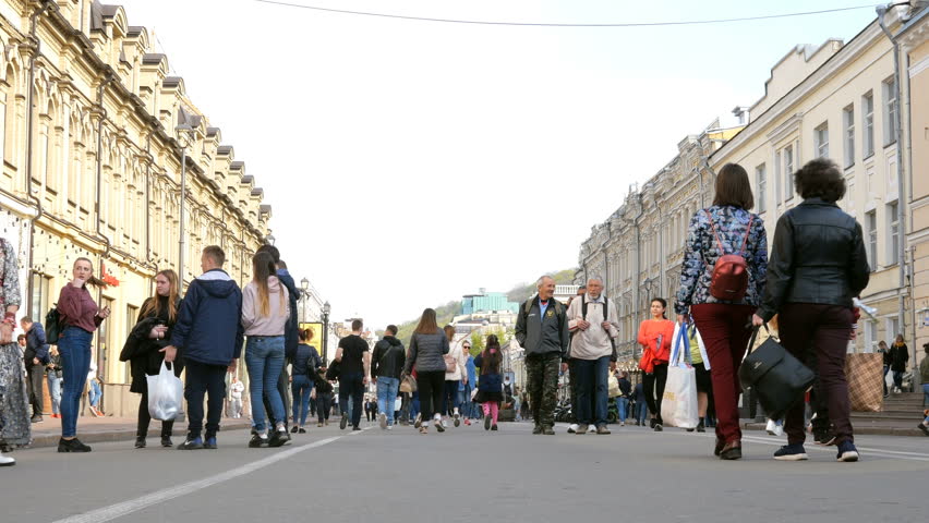 Kiev, Ukraine, April 2019: - People walk on weekend on Kontraktova Square and Sagaydachnogo Street in Kiev, Ukraine. Kiev is popular tourist destination in Europe.