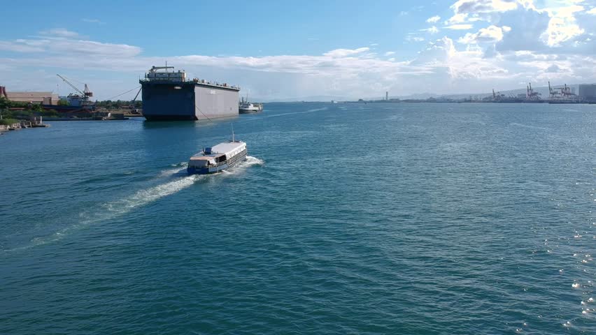 Drone shoot of a ferry boat going to the sea