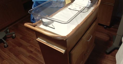 Davenport, Iowa - April 15, 2019, Baby Bassinet And Warming Table In Hospital Delivery Room - Tilt Up